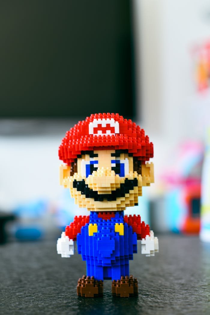 A pixelated building block toy of a famous video game character with a blurred background.